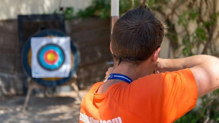 A man targeting with his bow and arrow in adventurous archery on the island.