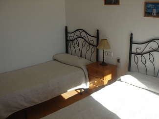 Room with two single beds in a rental house of Ibiza