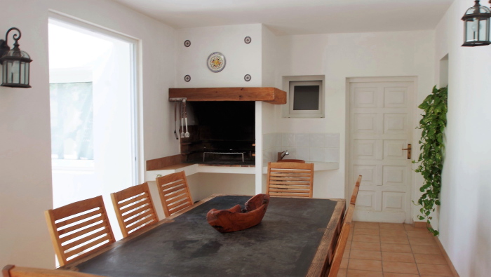 Inside dining room with a barbecue