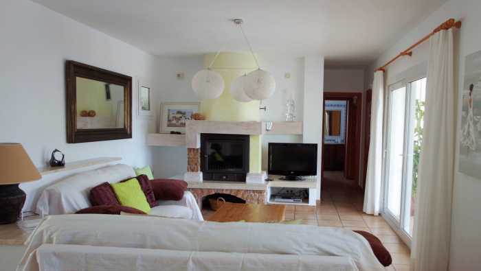 Living room with fireplace in a house of Ibiza