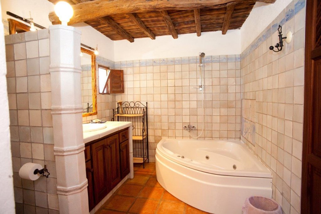 Rustic bathroom with jacuzzi